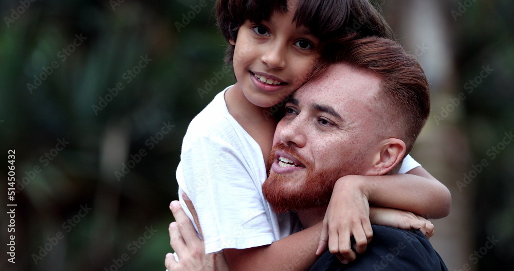 Father and son embrace, child hugging parent, diversity mixed race Father and son embrace, child hugging parent, diversity mixed race