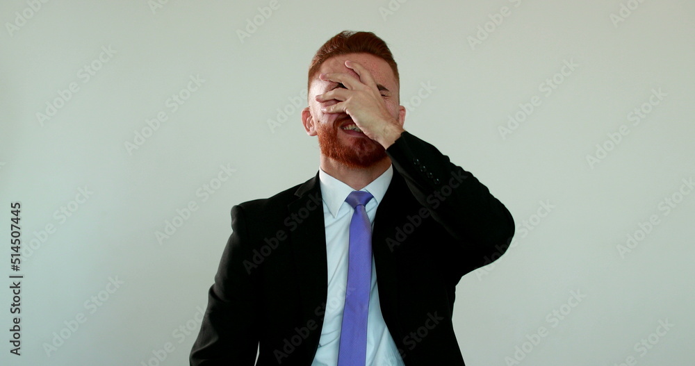 Excited executive business man celebrates success by raising fist in air and smiling Excited executive business man celebrates success by raising fist in air and smiling