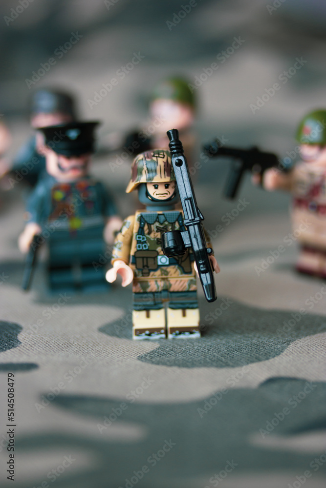 Kyiv, Ukraine. March 9, 2022. LEGO soldiers from Second World War. Toy  soldier in camouflage uniform with machine gun, weapon. Troops, regiment.  War in Ukraine. Formations of armed forces, military. Stock Photo
