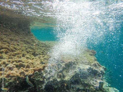 underwater blue ocean wide background with sandy sea bottom, Real natural underwater view of the Mediterranean Sea, undersea and underocean, under water empty swimming pool background with copy space.