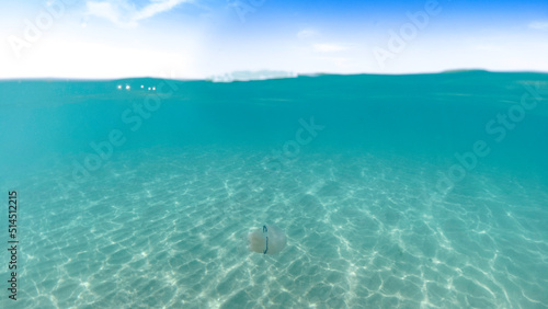 underwater blue ocean wide background with sandy sea bottom, Real natural underwater view of the Mediterranean Sea, undersea and underocean, under water empty swimming pool background with copy space.