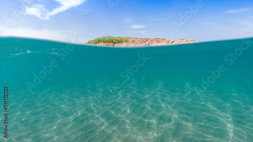 underwater blue ocean wide background with sandy sea bottom, Real natural underwater view of the Mediterranean Sea, undersea and underocean, under water empty swimming pool background with copy space. photo