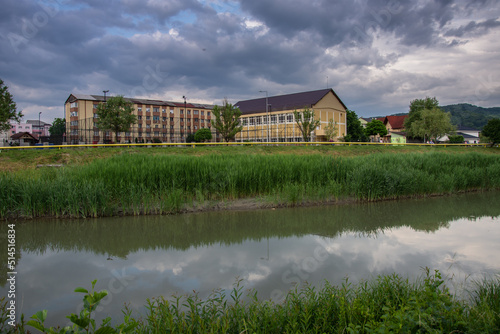 Romania, Bistrita, School near the Bistrita River in June 2022