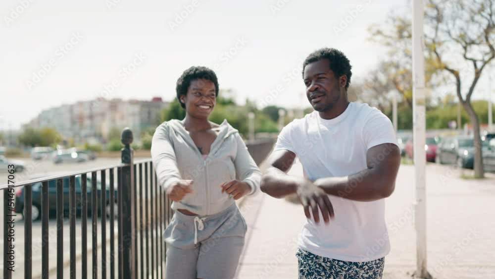 African american man and woman couple dancing at street African american man and woman couple dancing at street