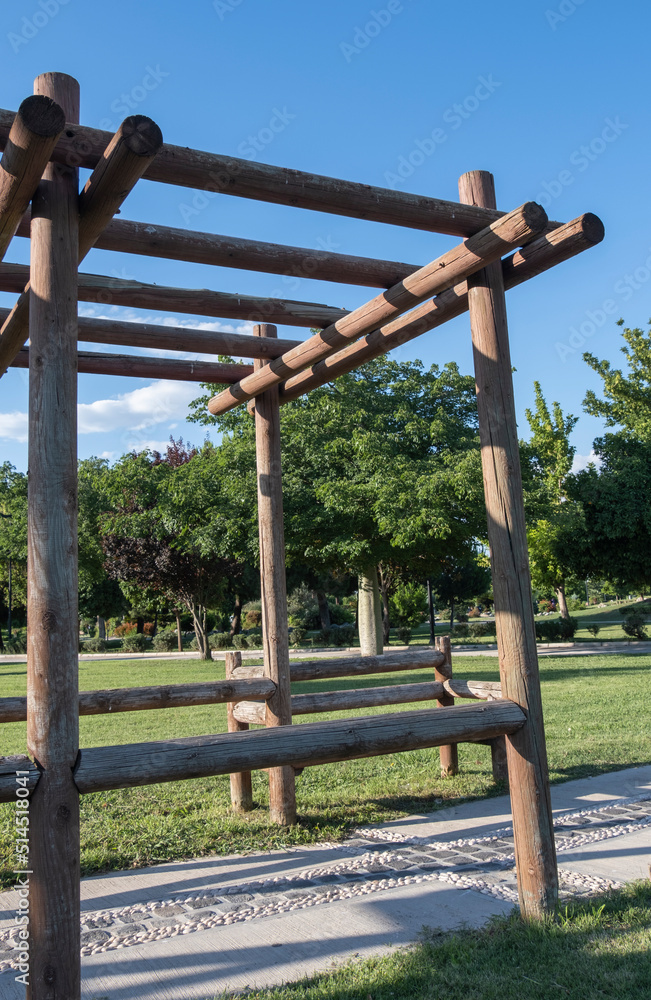 Pergola made with natural wood material in the city park Pergola made with natural wood material in the city park