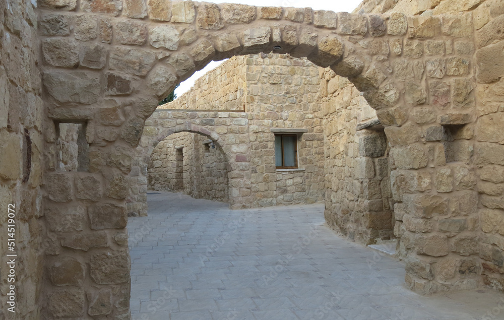 Middle Eastern village with houses made with stones and an arch