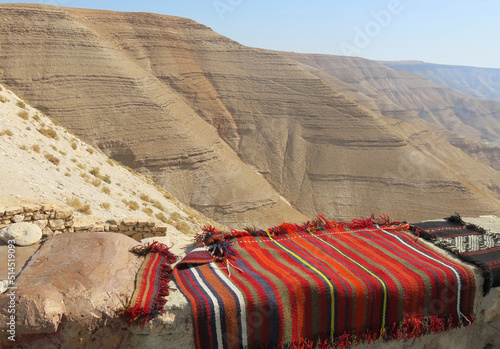sale of carpets and textiles in the desert and the sandy mountains photo