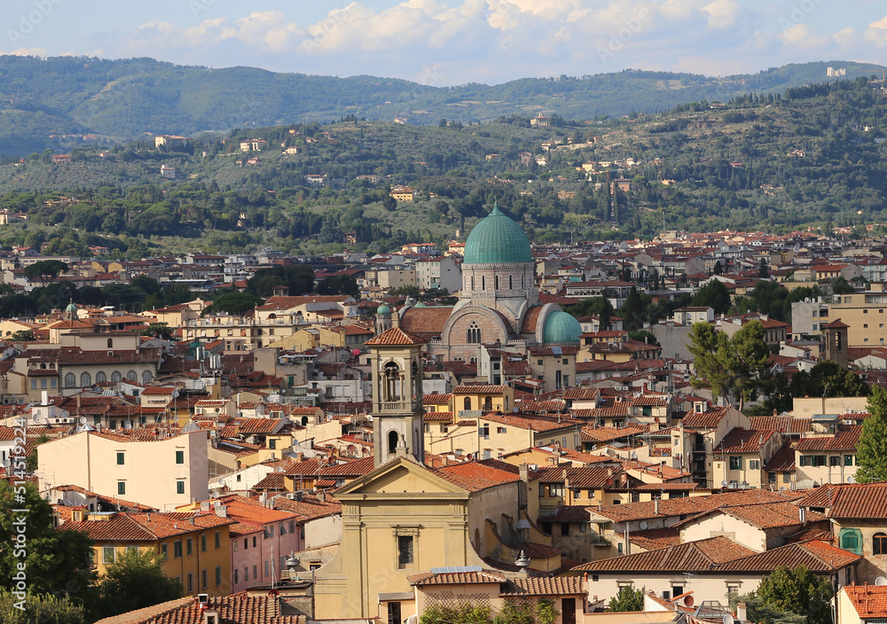 Domes of the synagogue of the city of Florence in the region of Tuscany and also the bell tower of a catholic church