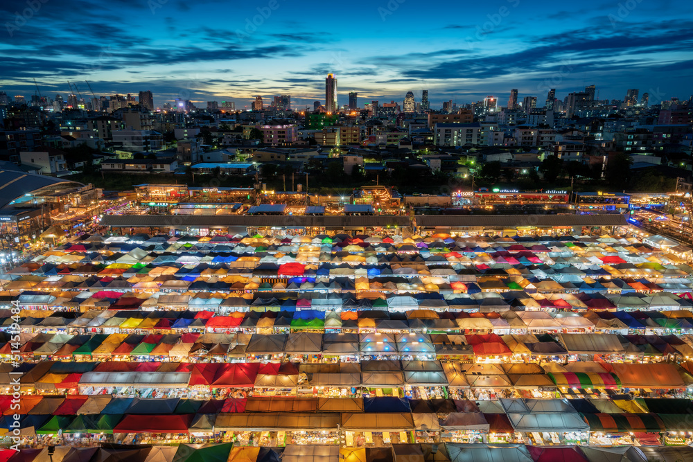 night market in thailand in front of Bangkok skyline
