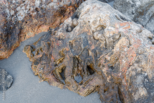 Sea waves lash line impact rock on the beach