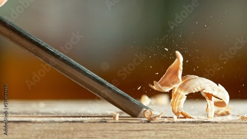 Super slow motion of detail of carving wood with a chisel. Low depth of focus, super macro shot. Filmed on high speed cinema camera, 1000 fps.
