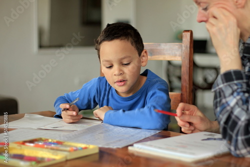 teacher and child reading a book together at school on white background with people stock photo 