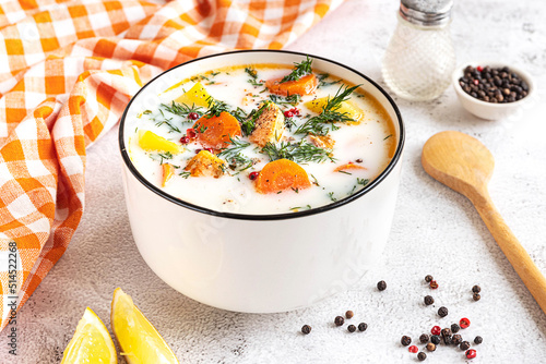 Lohikeitto, Finnish creamy salmon soup in a white bowl photo