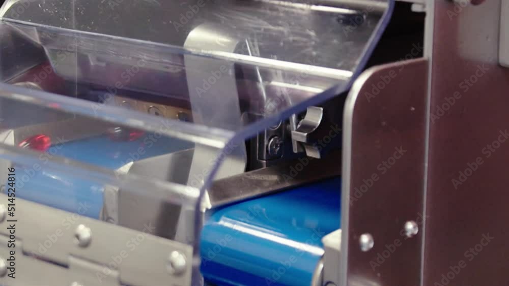 The tablets move on the conveyor belt . the close-up of pharma production. The tablets move on the conveyor belt . the close-up of pharma production.