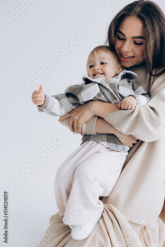Mother, little daughter isolated on white background, studio portrait, mother's day, love, family, parenting, childhood, concept
