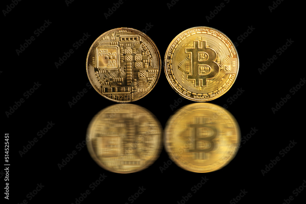 Bitcoin, bitcoin coins placed on a dark reflective background, selective focus. Bitcoin, bitcoin coins placed on a dark reflective background, selective focus.