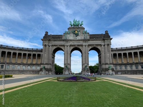 The Cinquantenaire memorial arch at the Parc du Cinquantenaire (Jubelpark). Flowers in front. Famous tourism and sightseeing place. Bruxelles, Brussels Capital Region, Belgium.