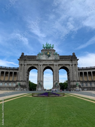 The Cinquantenaire memorial arch at the Parc du Cinquantenaire (Jubelpark). Flowers in front. Famous tourism and sightseeing place. Bruxelles, Brussels Capital Region, Belgium