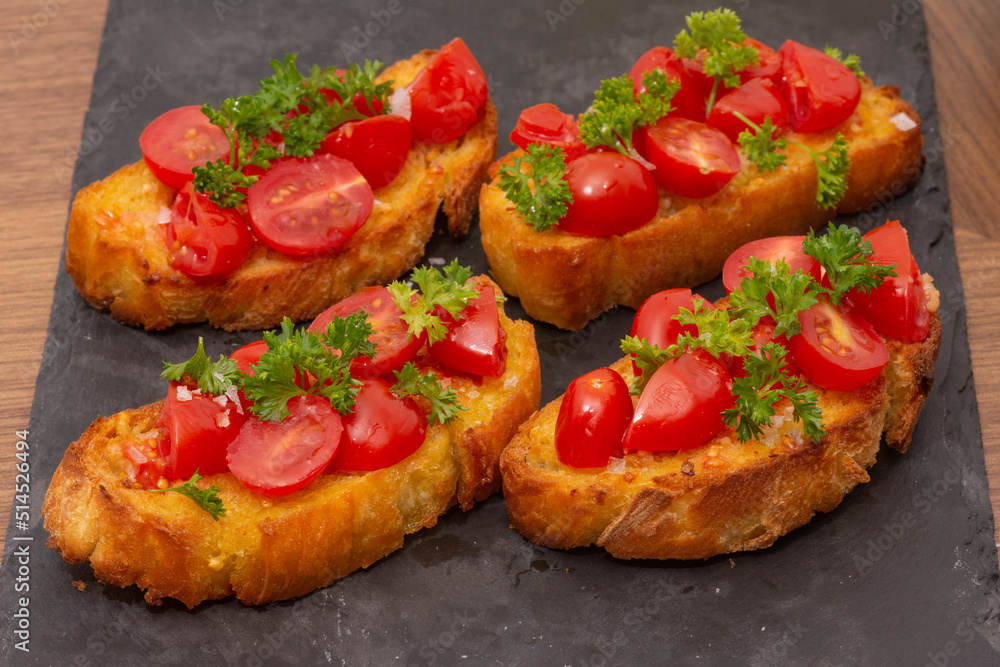 Bruschetta on a Charcoal Cutting Board