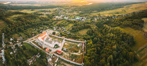 Aerial View Of Jesuit Collegium Complex. Top View Of Holy Nativity-The Theotokos Yurovichi Monastery. Drone View Of Beautiful European Nature From High Attitude In Summer Season. Bird's Eye View