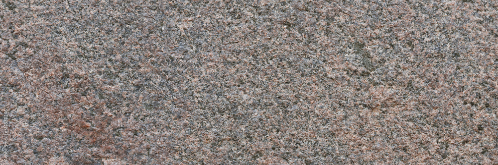 Granite texture. Natural pink granite with a grainy pattern. Stone background. Solid rough surface of rock. Durable construction and decoration material. Close-up. Granite texture. Natural pink granite with a grainy pattern. Stone background. Solid rough surface of rock. Durable construction and decoration material. Close-up.