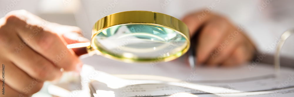 Businessman examining bill Businessman examining bill