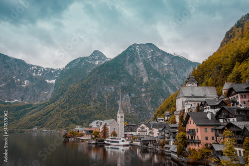 Beautiful view of Hallstatt, Austria, picturesque village on the edge of a lake. Classical view looking through towards the church and a line of houses.