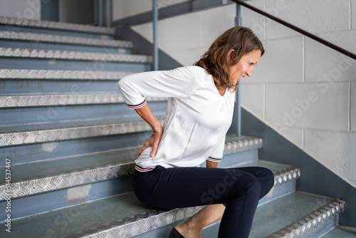 Mature Woman Lying On Staircase