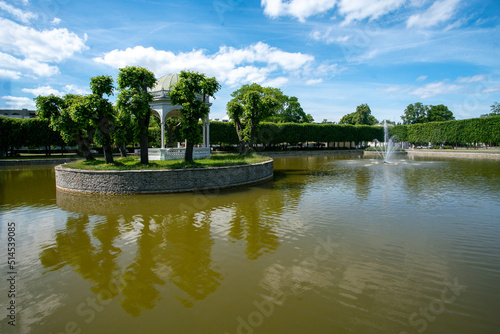 Quadro su tela Pond in Kadriorg   and fountain  inside pond and small island with trees