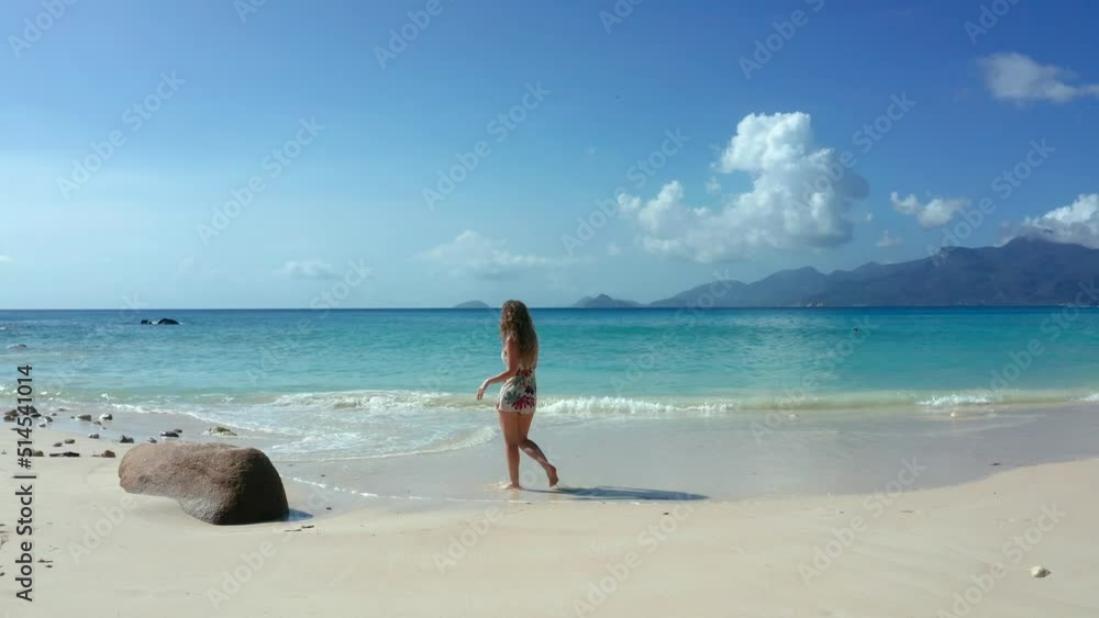 Girl on beach in Mahe Island Seychelles, Anse Petite Girl on beach in Mahe Island Seychelles, Anse Petite