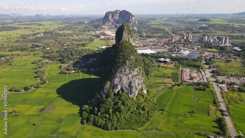 The Limestone Keteri Hill and The Surrounding Rice Paddy Fields photo