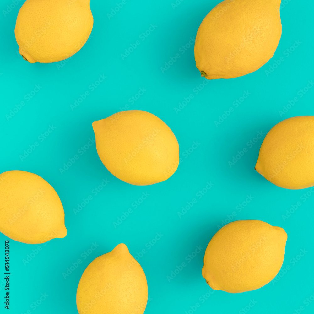 Creative summer pattern made of lemons on bright blue background. Fruit minimal concept. Creative summer pattern made of lemons on bright blue background. Fruit minimal concept.
