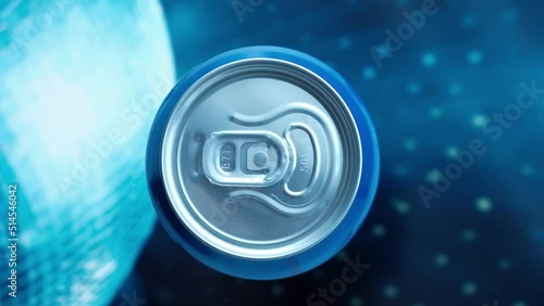 hand takes a metal can of a cool drink