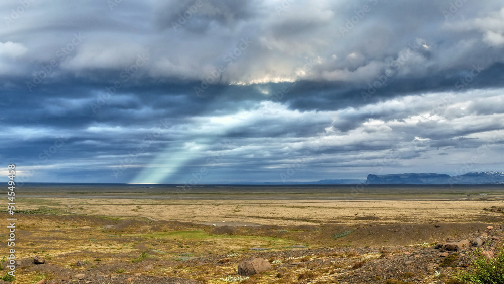 Iceland, dramatic sky and sunbeam in landscape