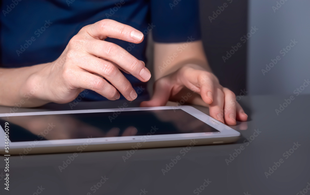 The hands of a businesswoman with a tablet The hands of a businesswoman with a tablet