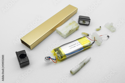 Disassembled into individual parts electronic cigarette. The internal device of the electronic cigarette. Vape device. Selective focus