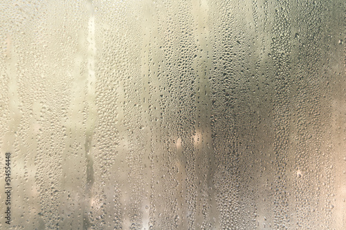 Condensate drops on the glass of a plastic window. Freezing and the formation of condensation and mold on the new plastic window. Defect in installation. Problem. Selective focus