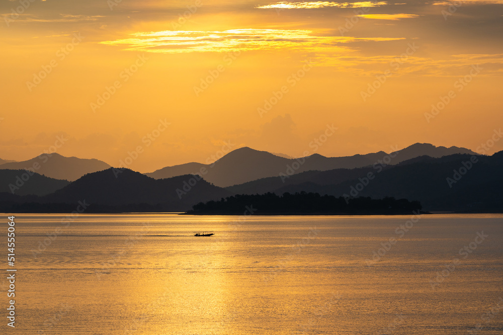 view of sunset over lake in Thailand view of sunset over lake in Thailand