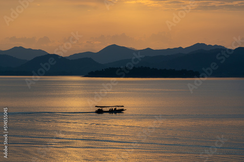 view of sunset over lake in Thailand © Prachya