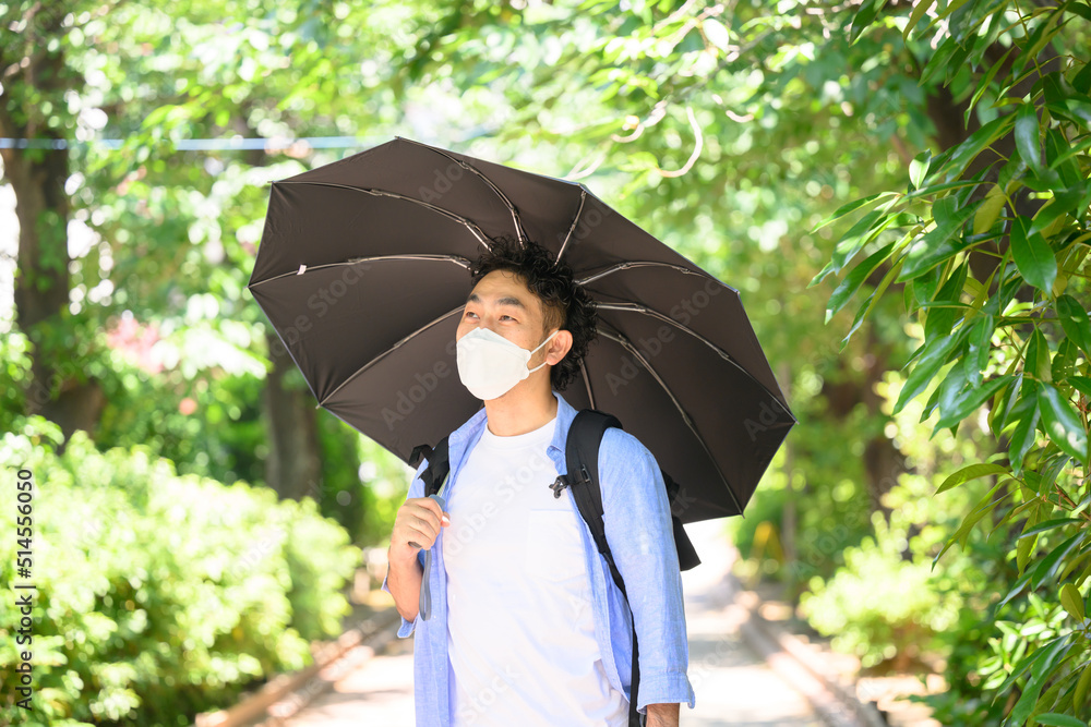 Man using parasol Mask - obrazy, fototapety, plakaty 