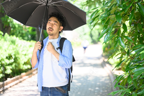 Man Wearing a Parasol photo