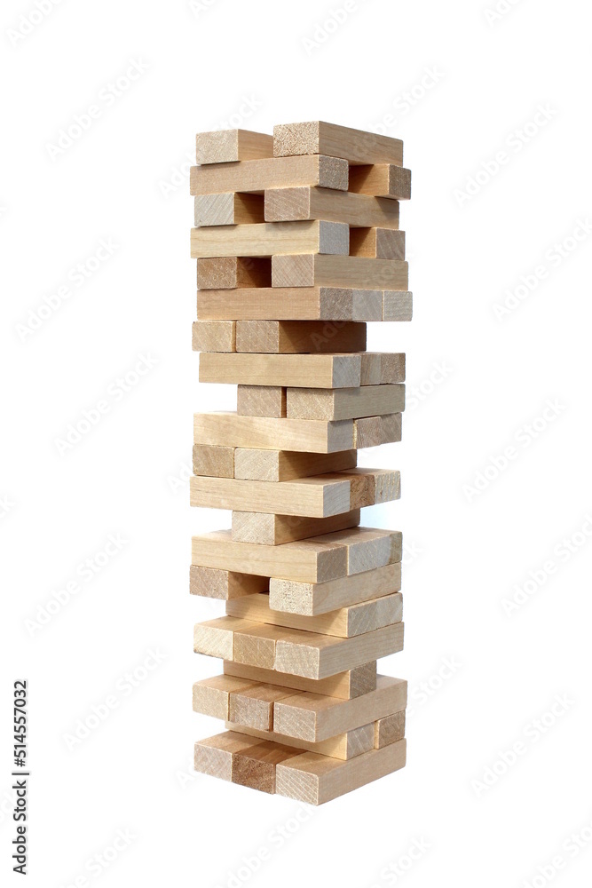 Tower made of wooden blocks on a white background. Tower made of wooden blocks on a white background.