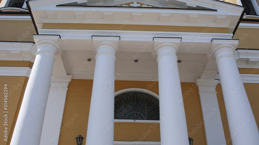 entrance to the catholic church with white columns entrance to the catholic church with white columns