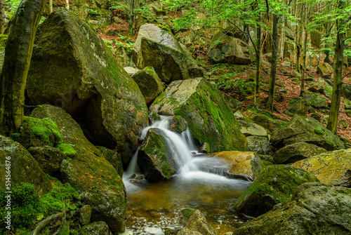 small waterfall on mountain creek between rocks
