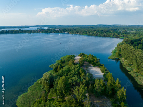 Aerial view of green lake nad forest in Poland. Summer time. 