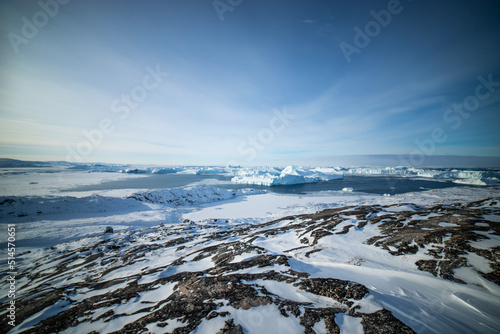 snow covered mountain and icebergs