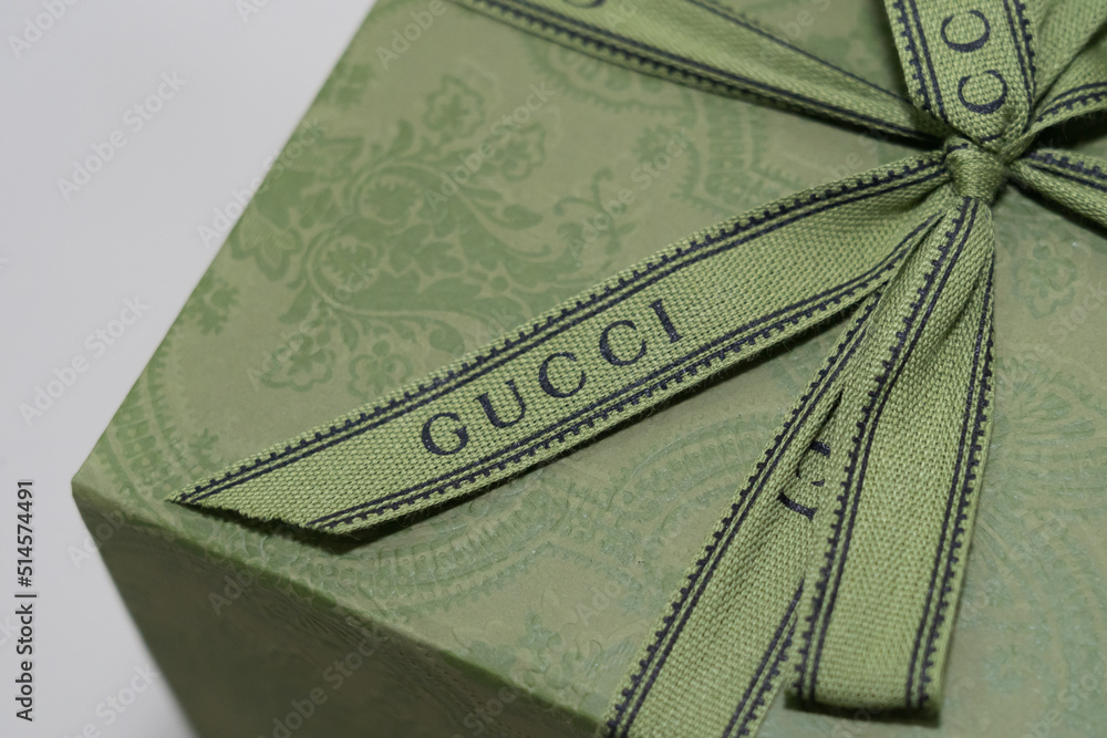 Close up of GUCCI Logo ribbon on gift box Stock Photo Adobe Stock