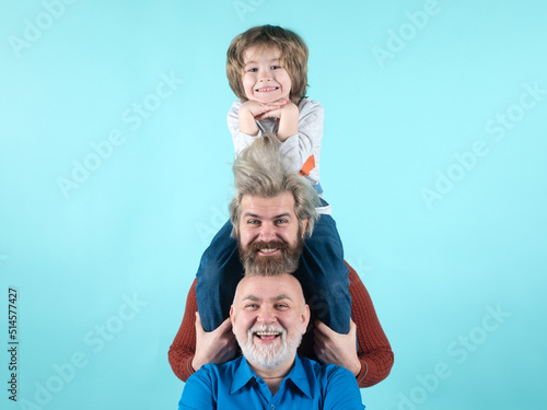 Portrait of happy grandfather father and son smilind. Fathers day concept. Man in different ages. Funny men faces. photo