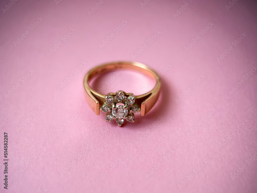 Gold diamond ring on pink isolated background. Red Gold Ring Gold diamond ring on pink isolated background. Red Gold Ring