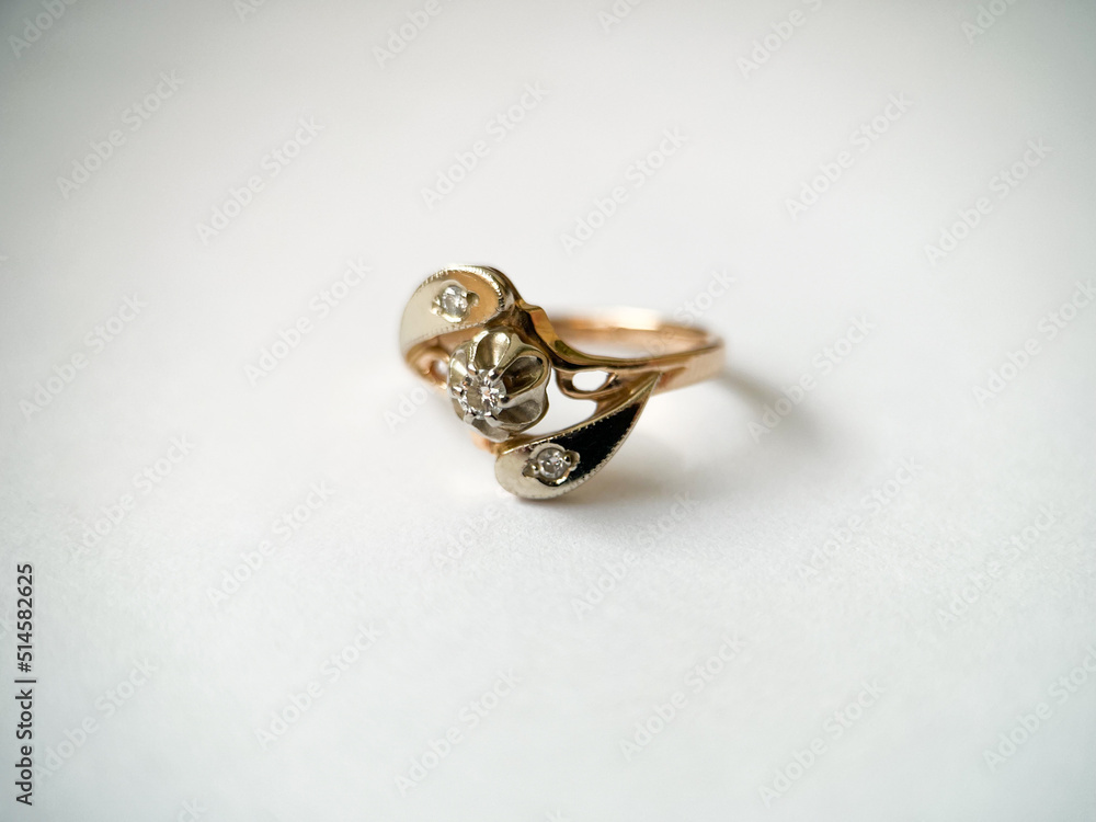 Gold diamond ring on a white isolated background. Red Gold Ring Gold diamond ring on a white isolated background. Red Gold Ring